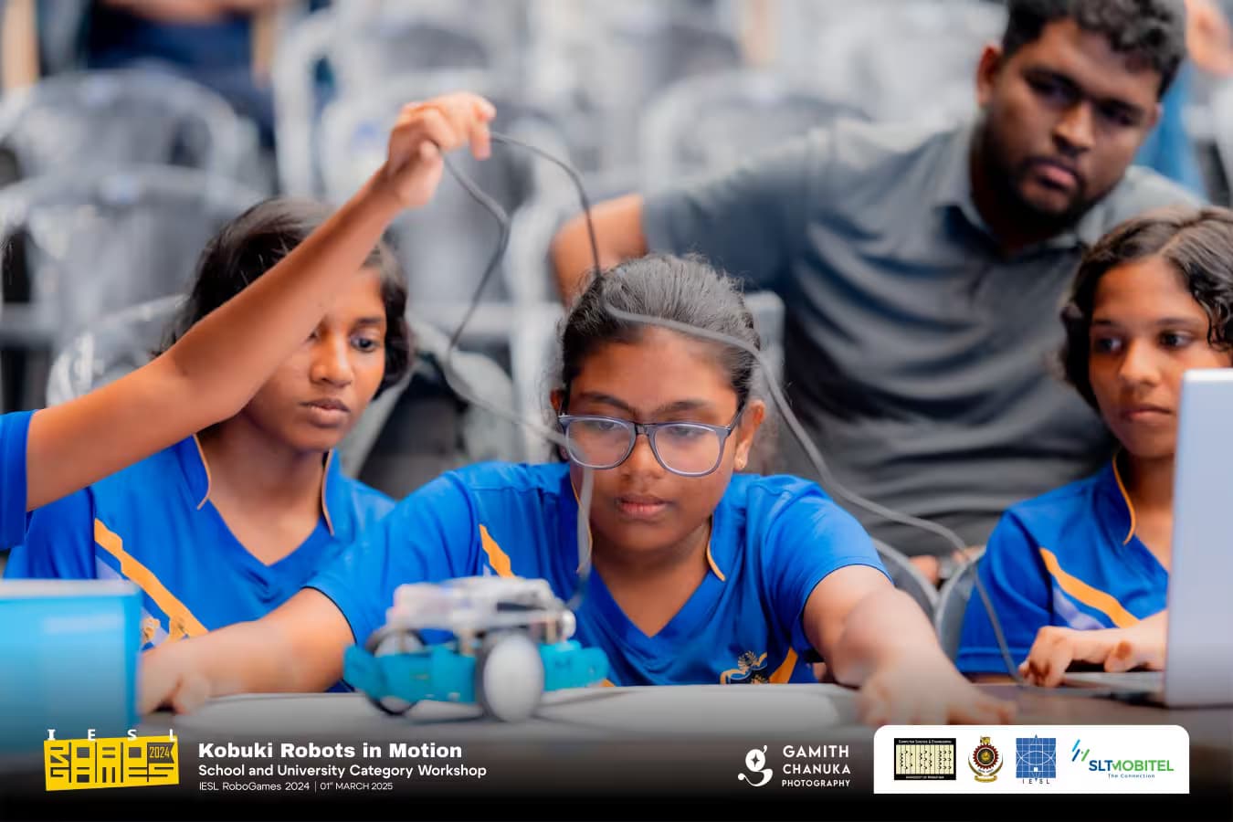 School category — students testing a robot at a workshop